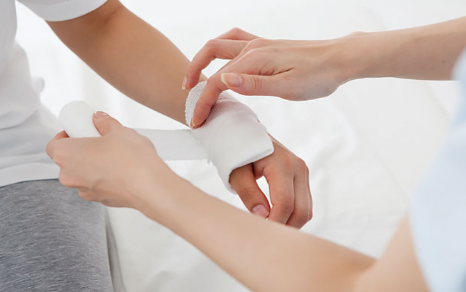 A picture showing proper methods for treatment of injury, including cleaning,  dressing
