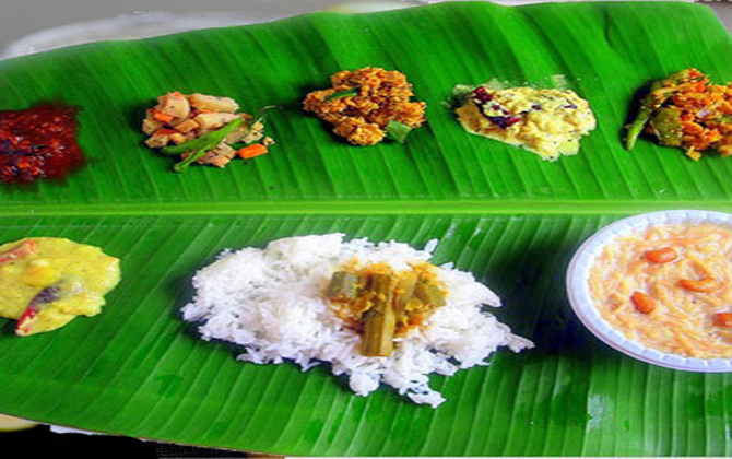 A variety of vegetarian dishes arranged on a banana leaf to showcase excellent veg catering abilities