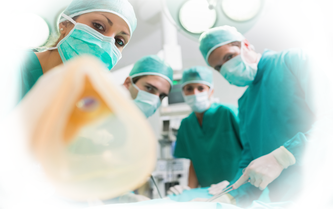 An operating room includes a group of critical-care surgeons carrying on a surgical procedure