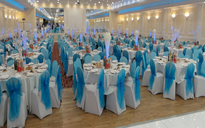 A banquet hall elegantly adorned in blue and white, perfect for hosting events and celebrations.