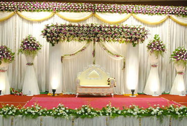 Wedding stage with stylish flowers, lighting and decorations to create a charming and lovely setting