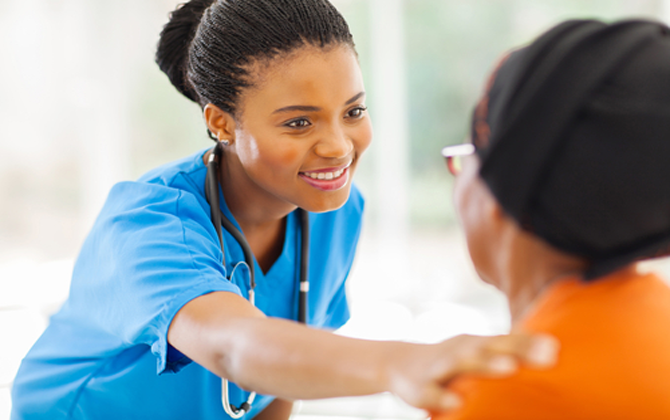 A nurse listens carefully to a patient while offering compassionate healthcare support and care.