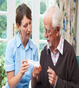 A nurse giving medication to an elderly man a caregiver providing pills to an elderly patient